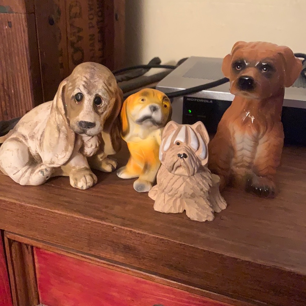 4 very cute dogs, 2 1/2 to 4 1/2 inches tall. Most porcelain, 1 resin
